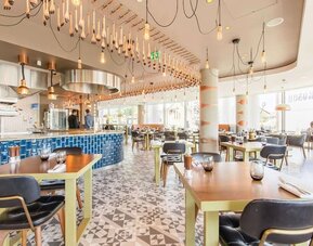 Dining area with natural light at Hilton Bournemouth.  