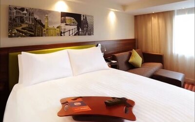 Day use room with sofa at Hampton By Hilton London Luton Airport.