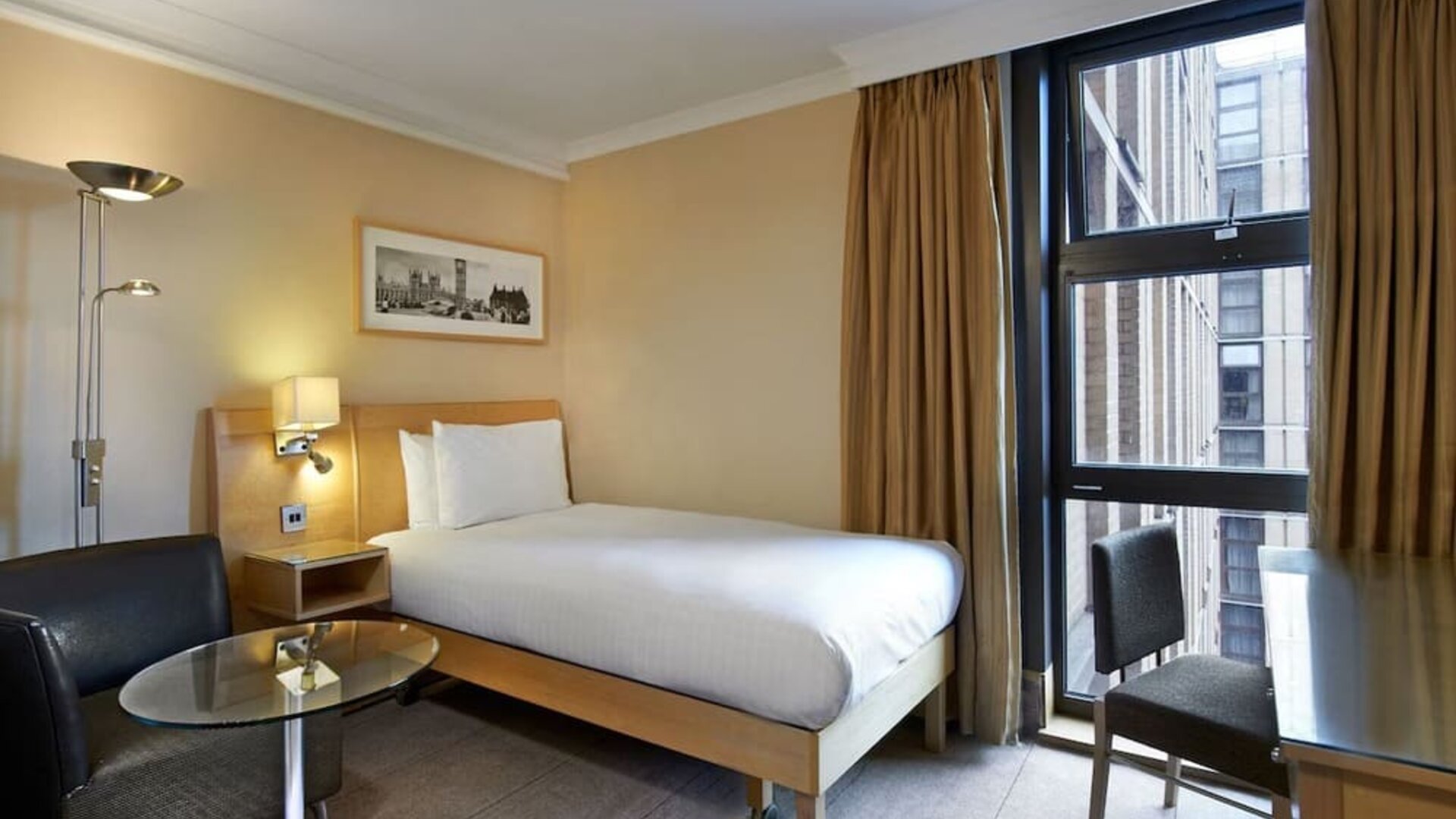 Day use room with furniture at Hilton London Kensington.
