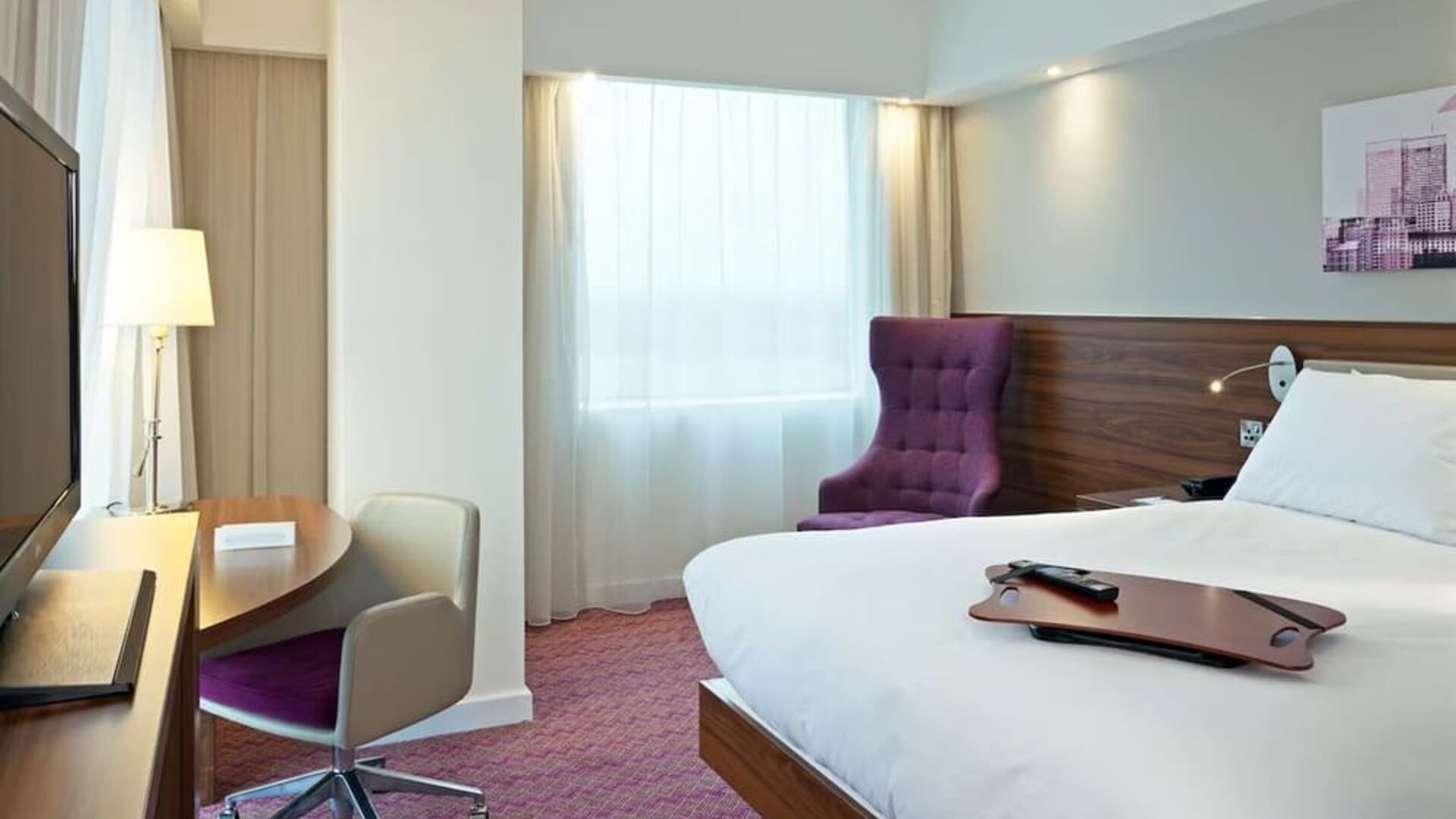 Hotel room with TV and workspace at Hampton By Hilton London Gatwick Airport.