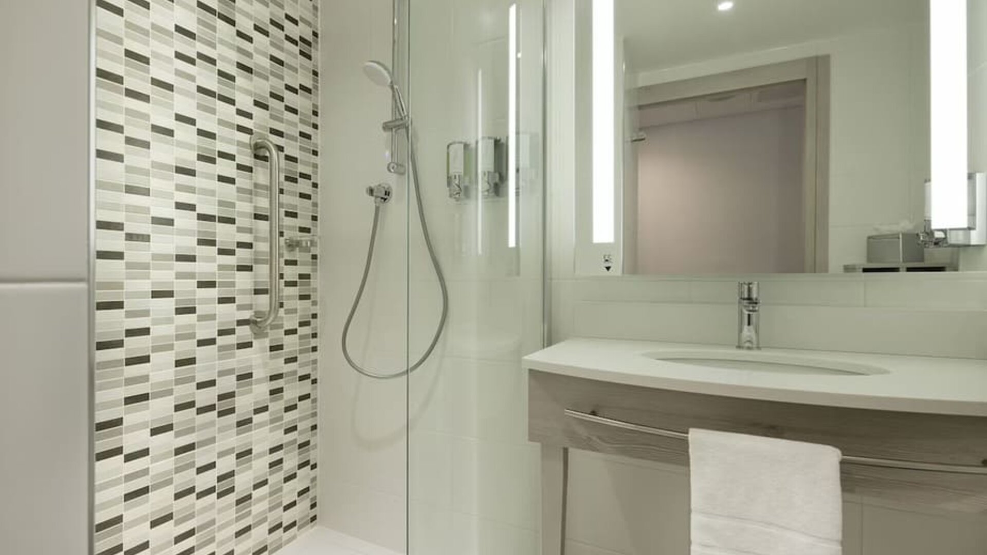 Guest bathroom with shower at Hampton By Hilton Leeds City Centre.