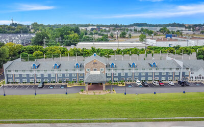Hotel exterior by day at Comfort Inn & Suites Nashville.