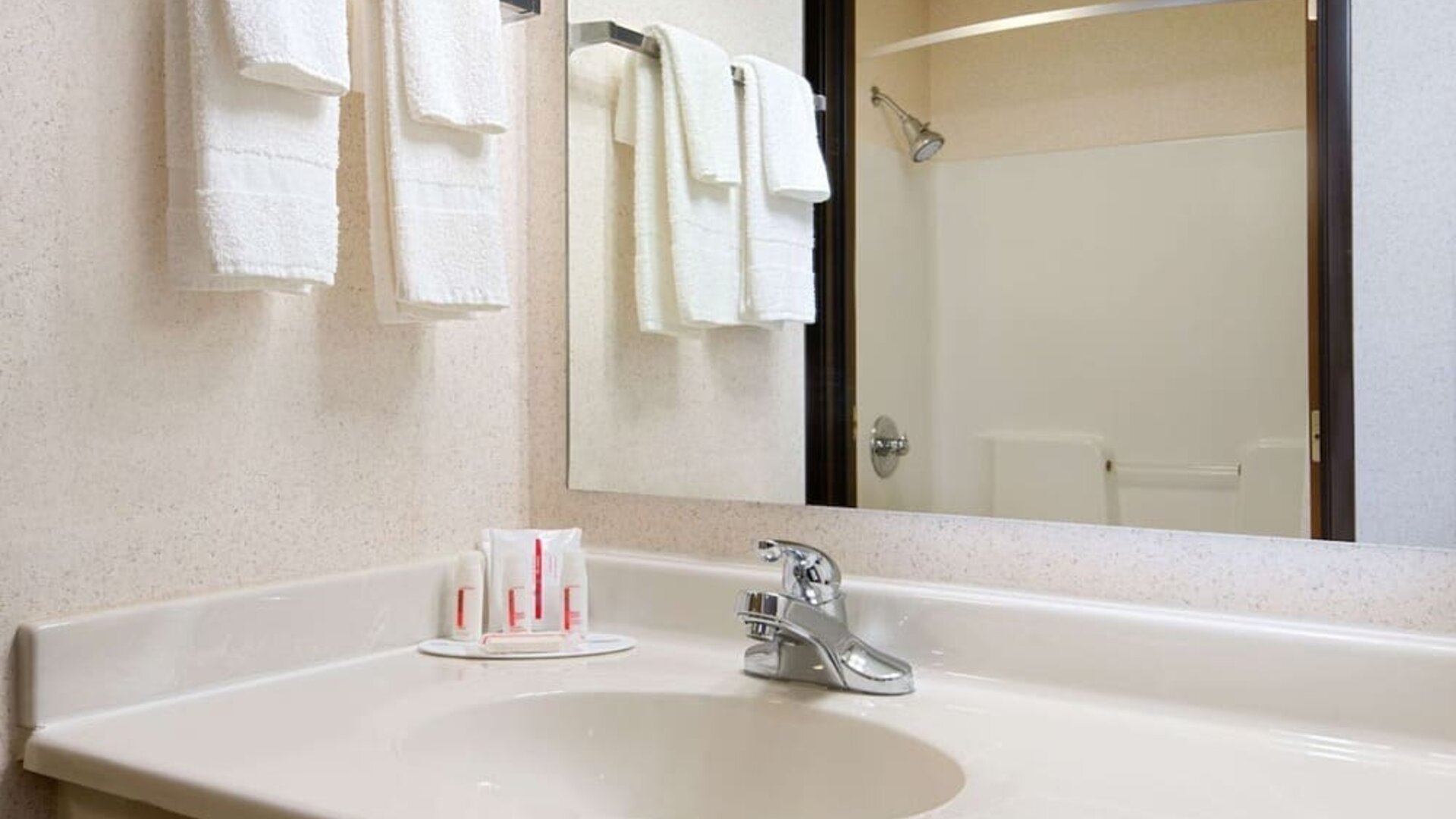 Private bathroom with shower at Baymont By Wyndham Pella.