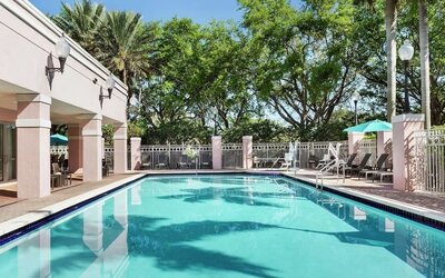 Refreshing outdoor pool at DoubleTree By Hilton Sunrise.