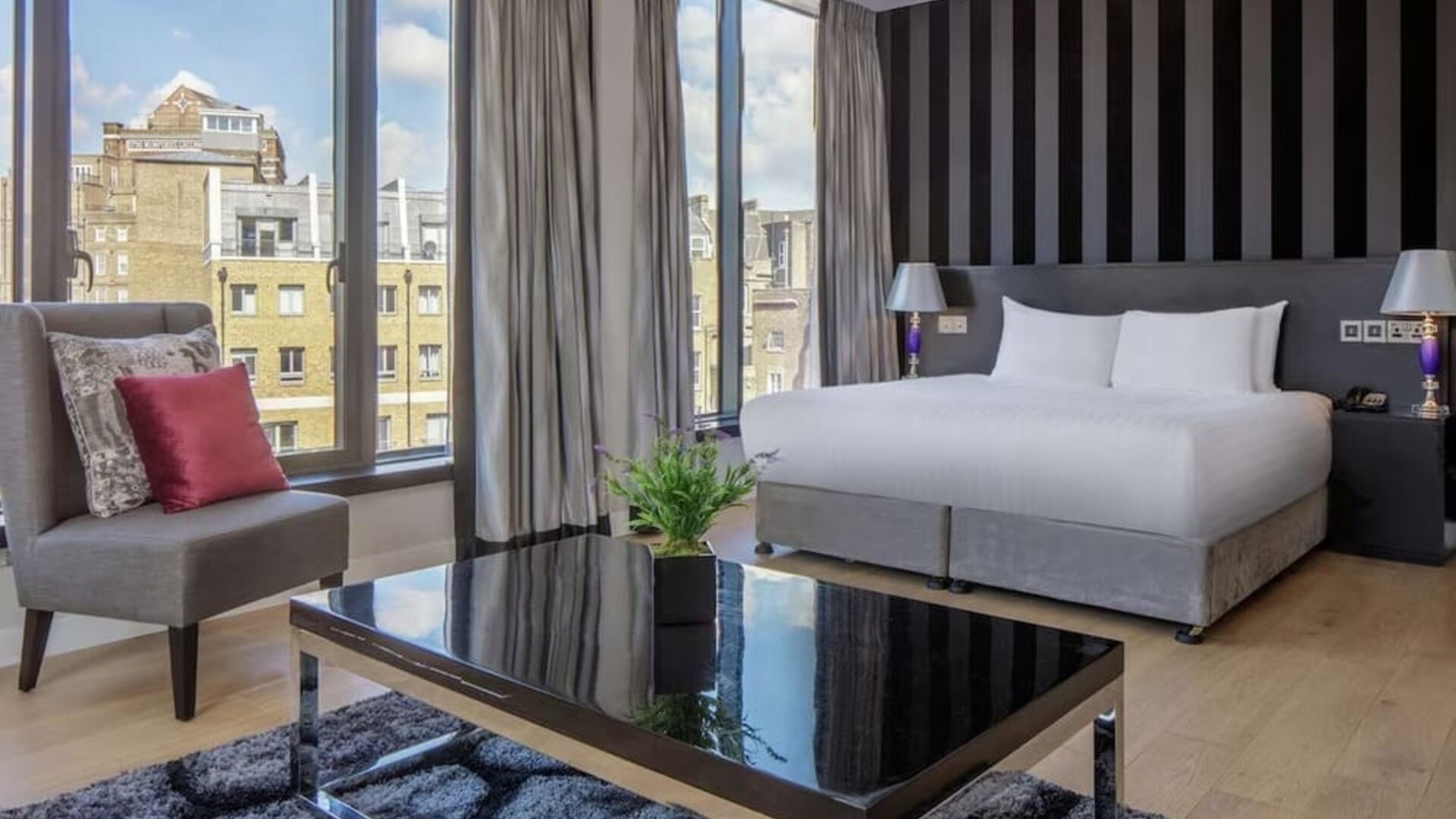 Spacious king suite with city views at DoubleTree by Hilton London Greenwich.