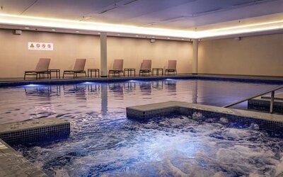 Refreshing indoor pool at Lincoln Plaza London, Curio Collection By Hilton.