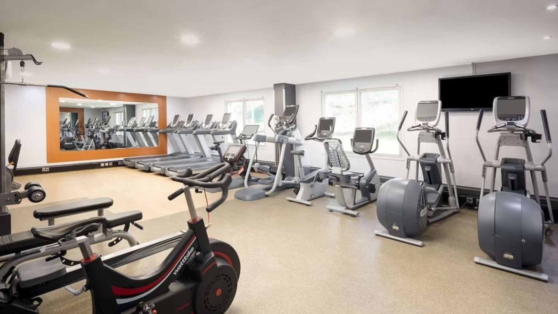 Fully equipped fitness center at Hilton London Heathrow Airport.