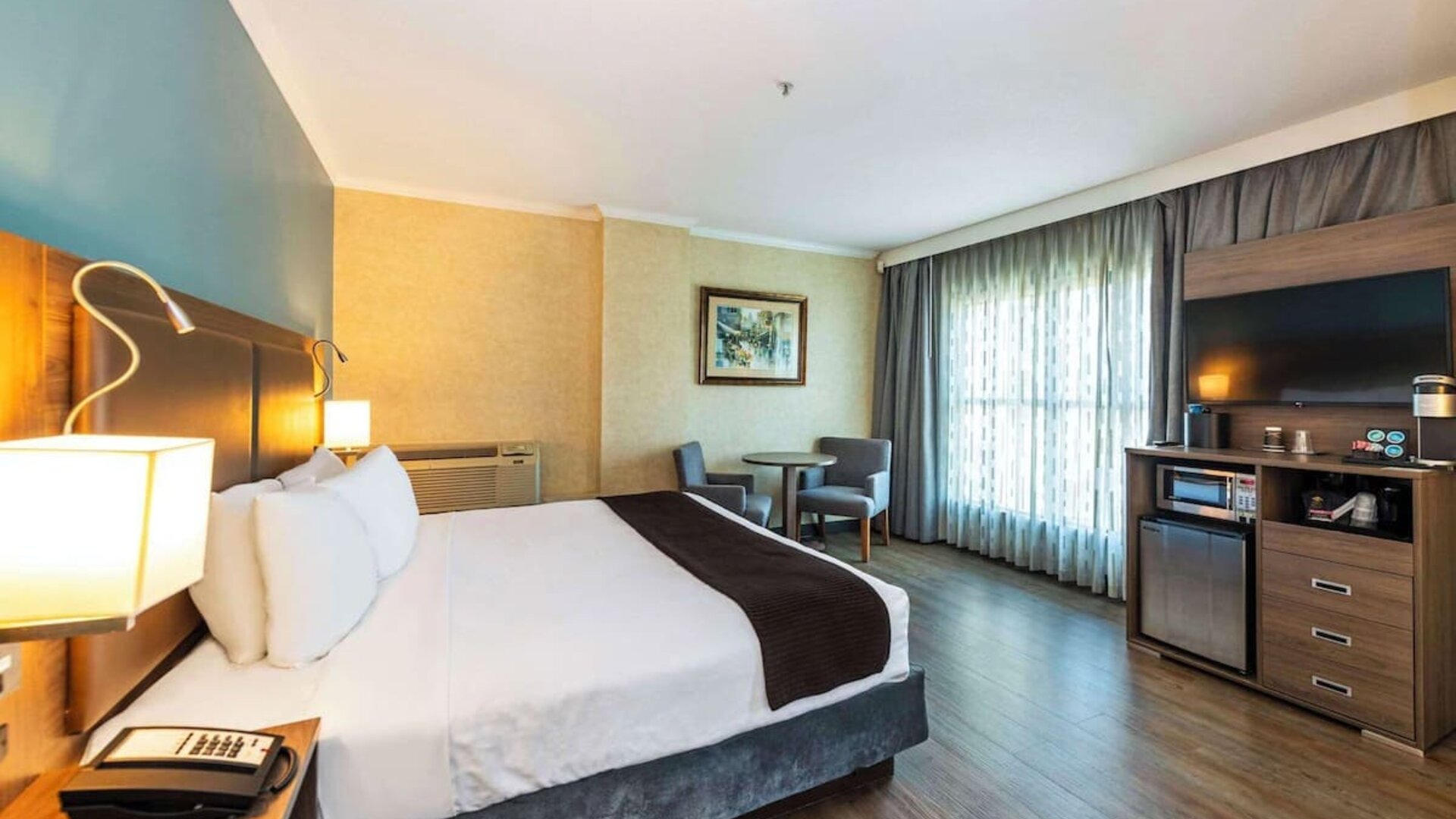 Romantic king room with TV at Grand Park Hotel & Suites Downtown Vancouver.