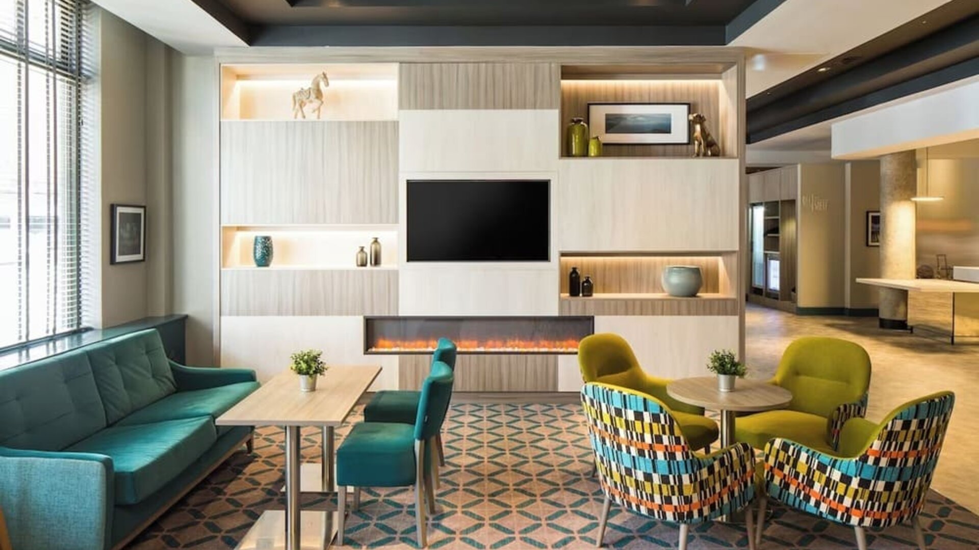 Lobby and coworking lounge at Leonardo Hotel Belfast.
