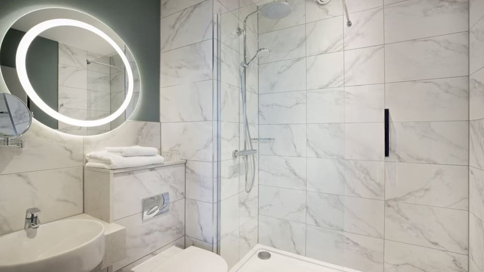Guest bathroom with shower at Leonardo Royal Hotel Birmingham.