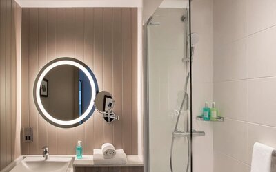 Guest bathroom with shower at Leonardo Royal Hotel Edinburgh.
