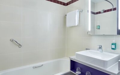 Guest bathroom with shower at Leonardo Hotel Exeter.