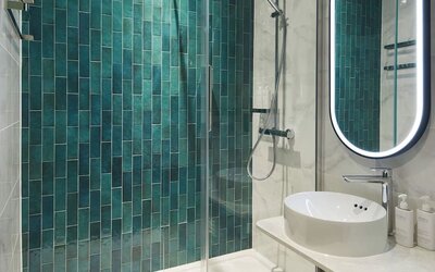 Guest bathroom with shower at Leonardo Royal Hotel Glasgow.