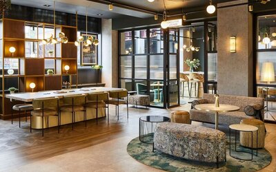 Lobby and coworking lounge at Leonardo Royal Hotel Glasgow.