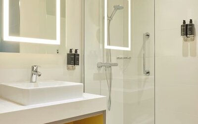 Guest bathroom with shower at Leonardo Royal Hotel Oxford.