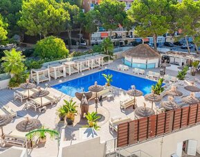 Outdoor pool with loungers at INN Mallorca Aparthotel.