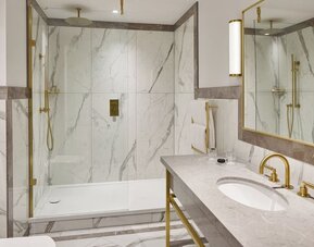 Guest bathroom with shower at The Grand Brighton. 