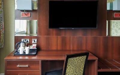 Day use room amenities like TV and coffee maker at Leonardo Inn Glasgow West End.