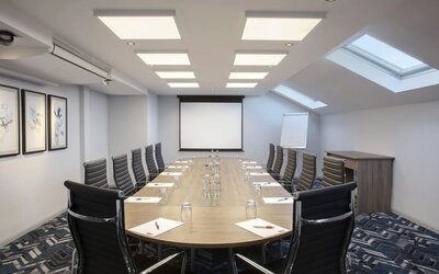 Professional meeting room at Leonardo Hotel London Heathrow Airport.