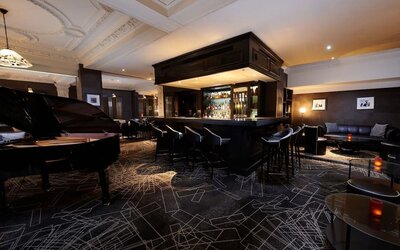 Stylish hotel bar with piano at The Dilly.  