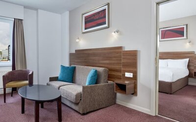 King suite with lounge at Leonardo Hotel Newcastle.