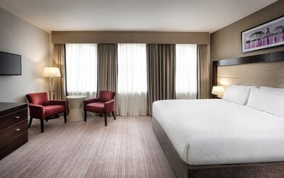 King bed with TV at Leonardo Hotel Cardiff.