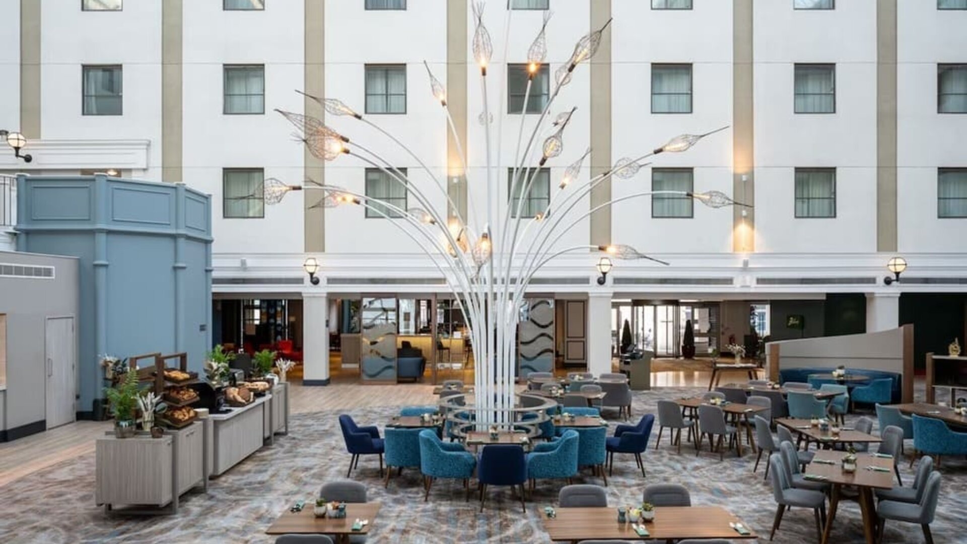 Dining area and lounge at Leonardo Royal Hotel Brighton Waterfront.