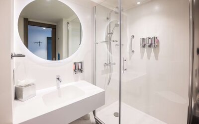 Guest bathroom with shower at Hampton By Hilton Blackpool.
