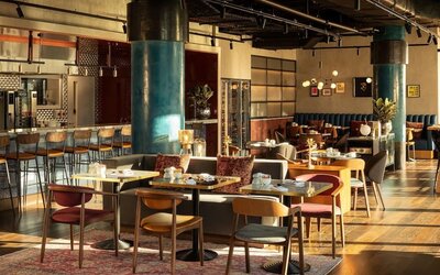 Dining area perfect for coworking at The Gantry London, Curio Collection By Hilton.