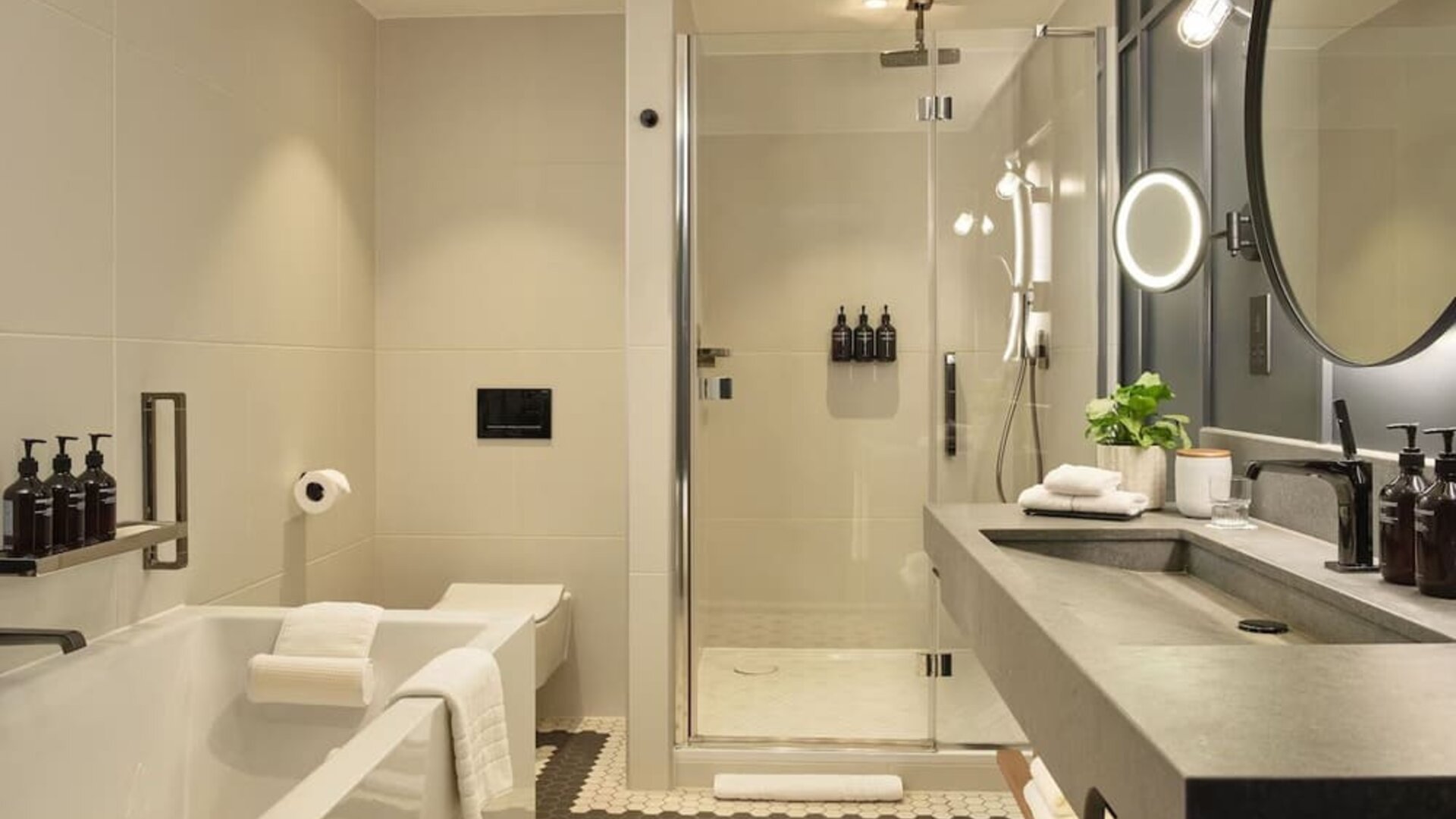 Guest bathroom with shower and tub at The Gantry London, Curio Collection By Hilton.
