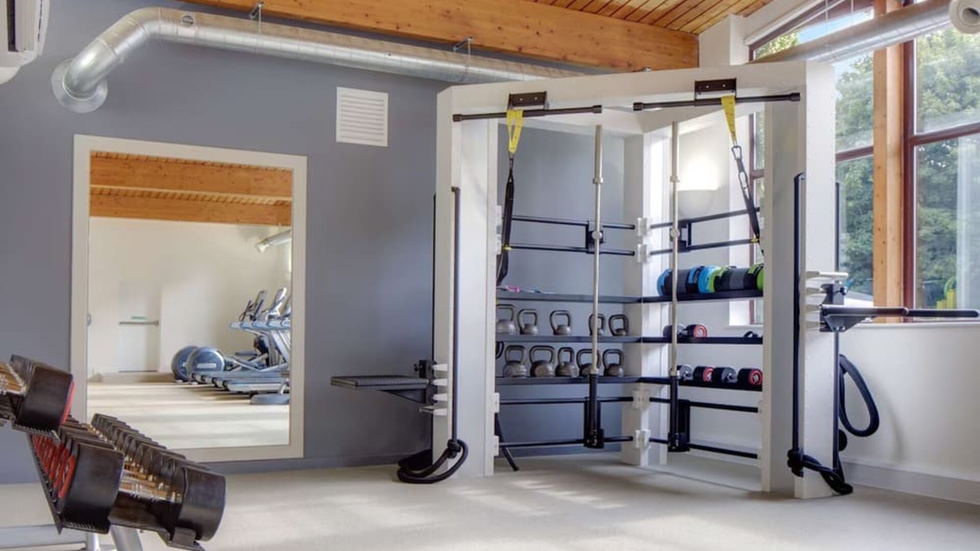 Fitness center with treadmills, machines and equipment at Hilton London Watford.