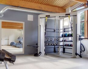 Fitness center with treadmills, machines and equipment at Hilton London Watford.
