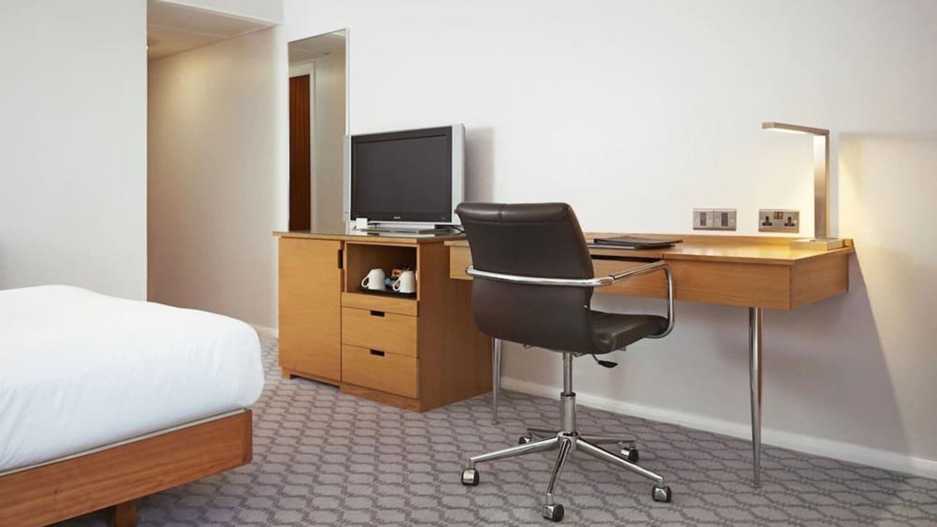 Day use room with TV and comfortable work desk at Hilton London Watford.