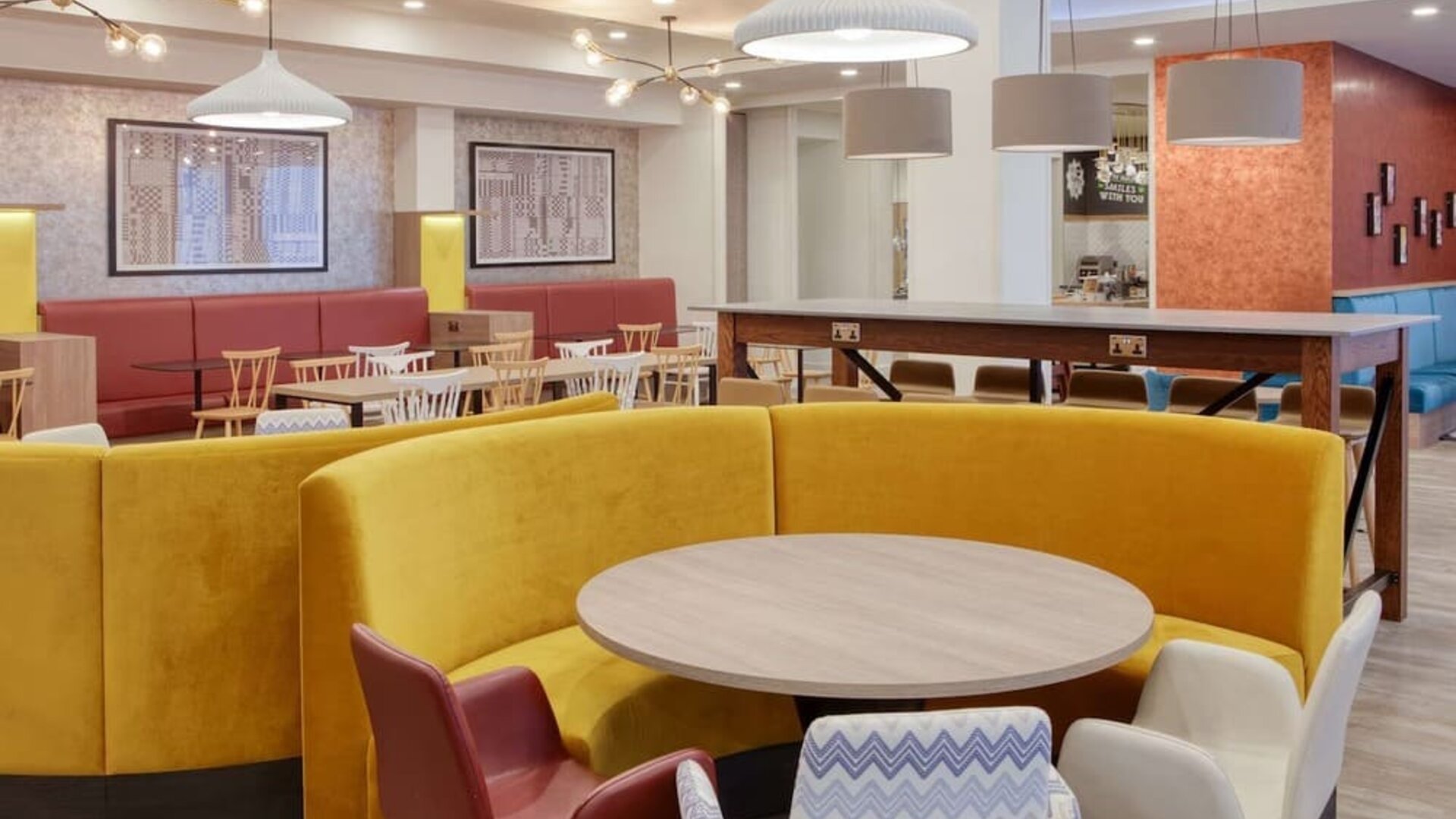 Colorful and comfortable dining area perfect for co-working at the Hampton by Hilton Manchester Northern Quarter.