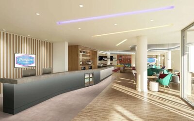 Bright lobby with lounge area at the Hampton by Hilton Manchester Northern Quarter.
