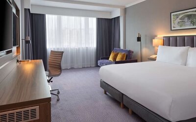 King bedroom with work desk at DoubleTree By Hilton Edinburgh Airport.