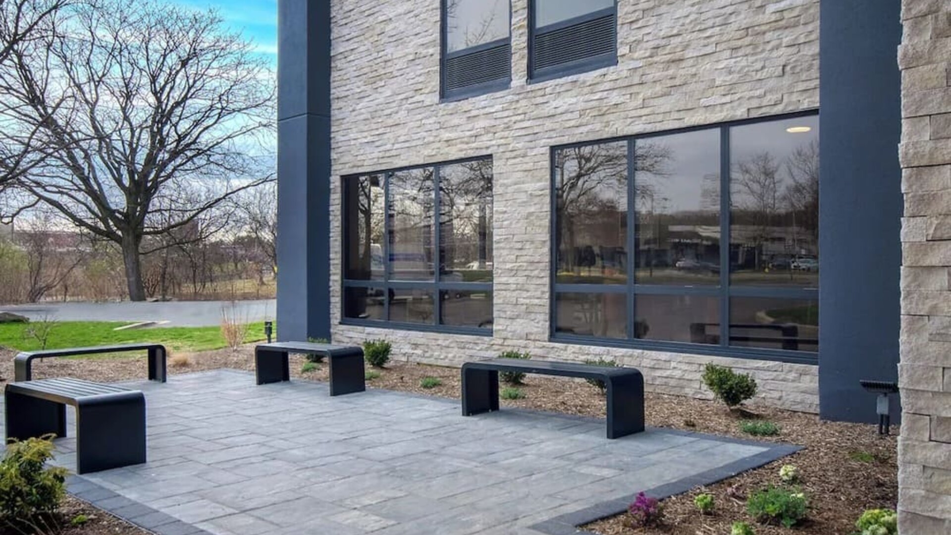 Outdoor seating and garden at Best Western Plus Secaucus Meadowlands.