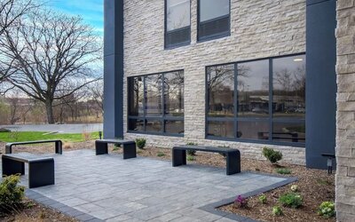 Outdoor seating and garden at Best Western Plus Secaucus Meadowlands.