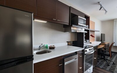 Kitchen area at TownePlace Suites Edgewood Aberdeen.