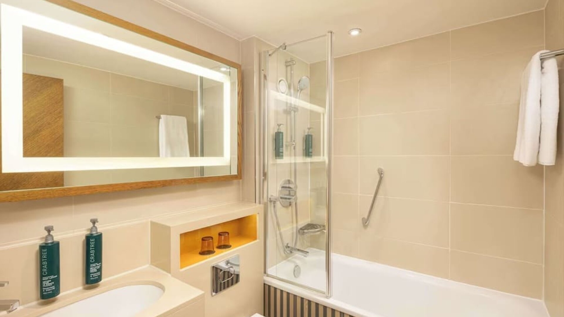 Guest bathroom with shower and tub at DoubleTree By Hilton London - Hyde Park.
