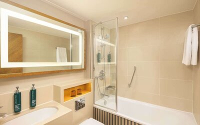 Guest bathroom with shower and tub at DoubleTree By Hilton London - Hyde Park.