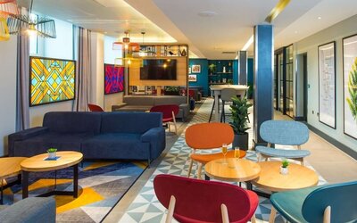 Lobby and coworking lounge at Hampton By Hilton London Park Royal.