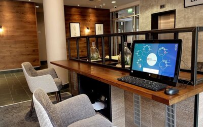 Business center with computer, printer and comfortable mobiliary at the Hilton Garden Inn Birmingham Brindleyplace.