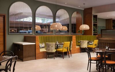 Stylinsh dining area with comfortable mobiliary perfect for co-working at the Hilton Birmingham Metropole.