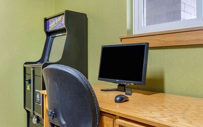 Work desk and ATM at Coratel Inn & Suites By Jasper River Falls.