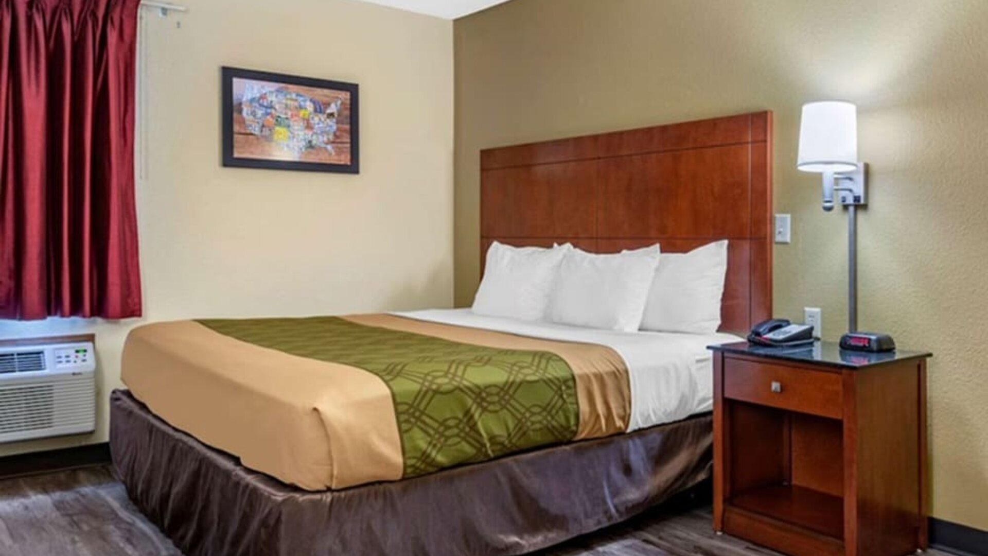 King room at Coratel Inn & Suites By Jasper River Falls.