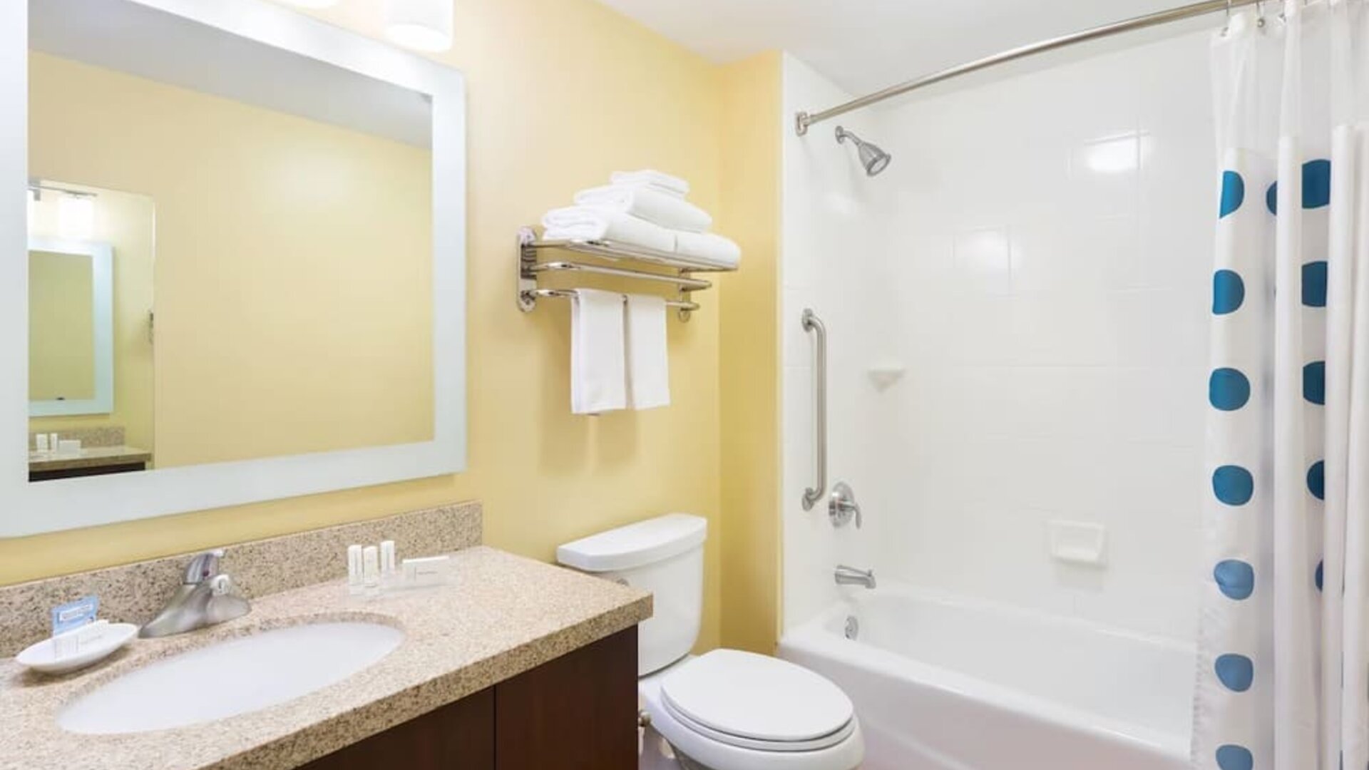 Guest bathroom with shower and tub at TownePlace Suites By Marriott Shreveport-Bossier City.