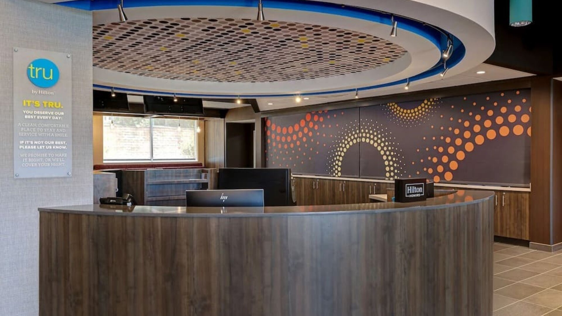 Modern reception area with front desk services and guest check-in at Tru By Hilton Lithia Springs.