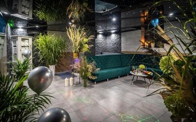 Stylish spa lounge with modern seating, greenery and ambient lighting at Hotel Seven.