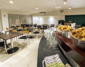 Bright breakfast and dining area offering comfortable seating and a buffet setup where guests can enjoy daily meals and refreshments at HR Plaza Luxor.